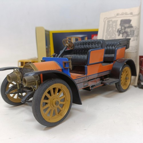 223 - A Schuco Tacho-Examico 4002 toy car, Schuco Akustico 2202, a reproduction Schuco Oldtimer boxed, and... 