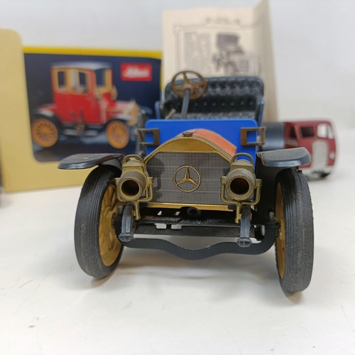 223 - A Schuco Tacho-Examico 4002 toy car, Schuco Akustico 2202, a reproduction Schuco Oldtimer boxed, and... 