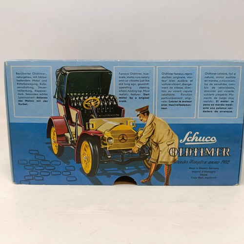 223 - A Schuco Tacho-Examico 4002 toy car, Schuco Akustico 2202, a reproduction Schuco Oldtimer boxed, and... 