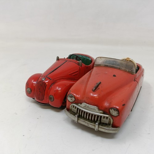 223 - A Schuco Tacho-Examico 4002 toy car, Schuco Akustico 2202, a reproduction Schuco Oldtimer boxed, and... 