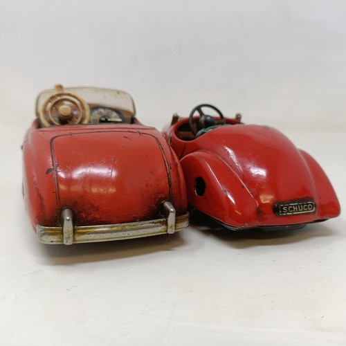 223 - A Schuco Tacho-Examico 4002 toy car, Schuco Akustico 2202, a reproduction Schuco Oldtimer boxed, and... 