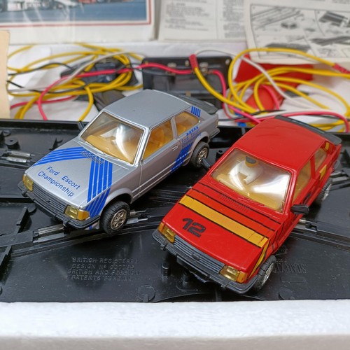 237 - A Scalextric Escort XR3i racing set, and assorted other Scalextric items (5)