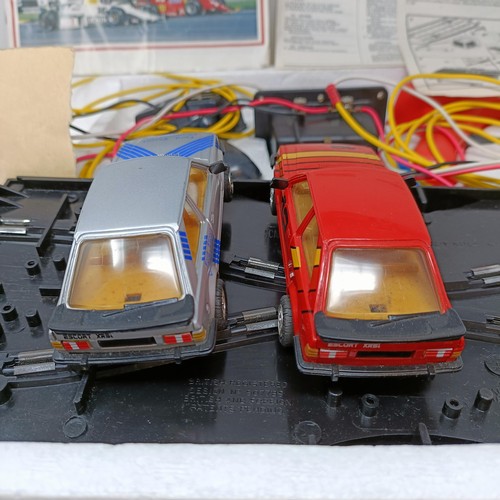 237 - A Scalextric Escort XR3i racing set, and assorted other Scalextric items (5)