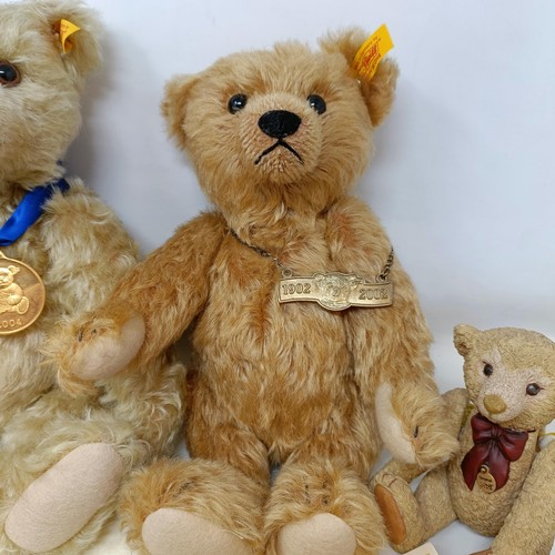 241 - A modern Steiff limited edition plush blonde teddy bear, No 5039, with certificate, and bag, two oth... 