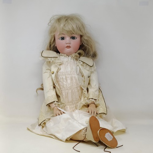 254 - A Simon & Halbig bisque headed doll, with millefiori eyes and a hinged composite body, 75 cm