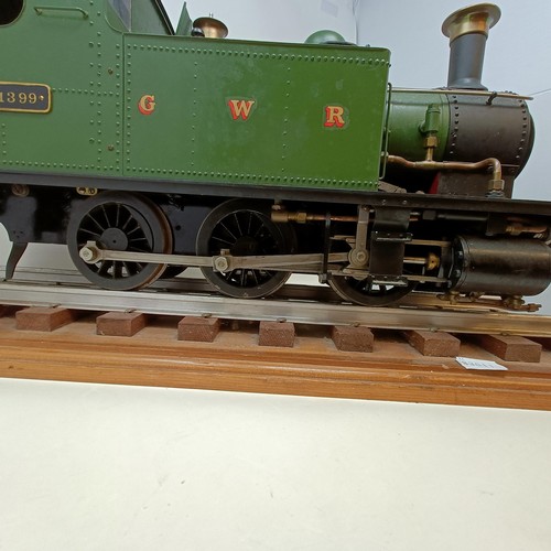 261 - A live steam 3.5 inch gauge 0-6-0 locomotive, in green livery, 50 cm, on a stand