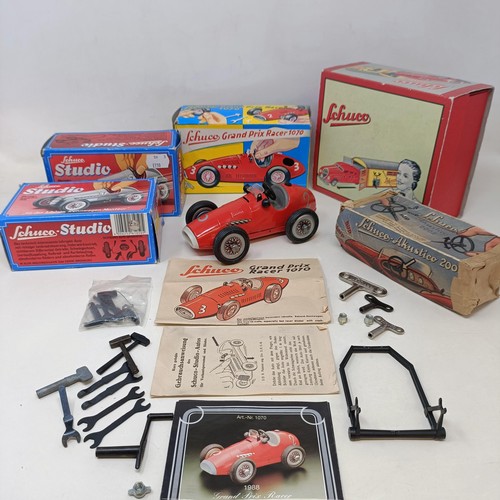 264 - A Schuco clockwork toy car No. 3041 boxed, and four other reproduction Schuco wind-up toys (5)