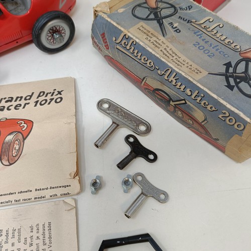 264 - A Schuco clockwork toy car No. 3041 boxed, and four other reproduction Schuco wind-up toys (5)