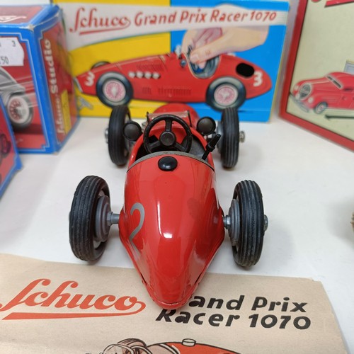 264 - A Schuco clockwork toy car No. 3041 boxed, and four other reproduction Schuco wind-up toys (5)