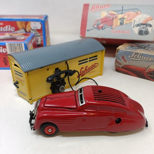 264 - A Schuco clockwork toy car No. 3041 boxed, and four other reproduction Schuco wind-up toys (5)