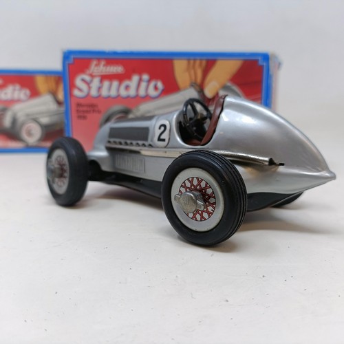 264 - A Schuco clockwork toy car No. 3041 boxed, and four other reproduction Schuco wind-up toys (5)