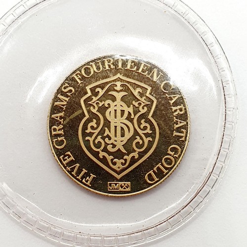 394 - A gold five gram token, for the Republic National Bank, New York