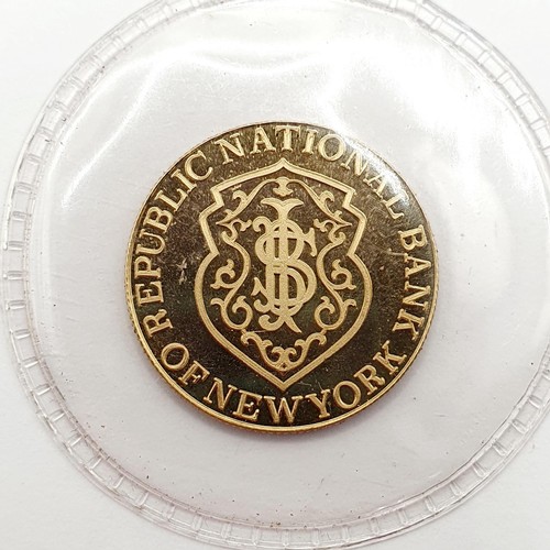 394 - A gold five gram token, for the Republic National Bank, New York