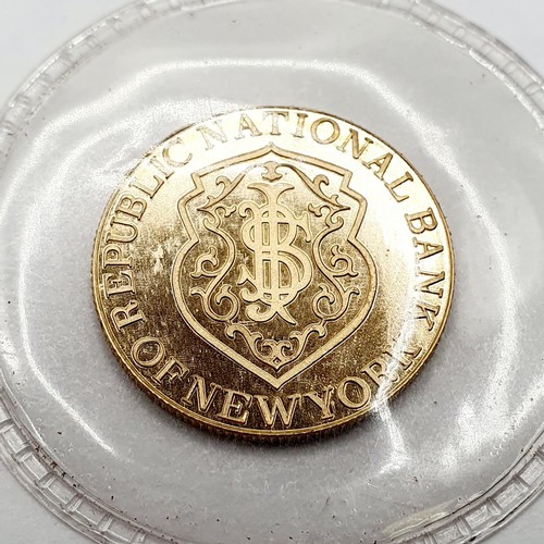 394 - A gold five gram token, for the Republic National Bank, New York