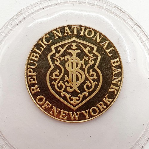 395 - A gold five gram token, for the Republic National Bank, New York