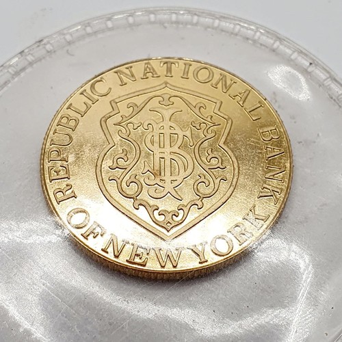 395 - A gold five gram token, for the Republic National Bank, New York