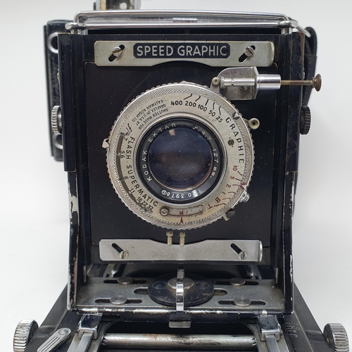 147 - A Graflex Speed Graphic bellows camera, with a kodak lens