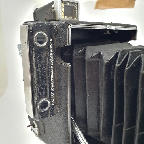 147 - A Graflex Speed Graphic bellows camera, with a kodak lens