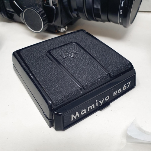 155 - A Mamiya RB67 Professional camera, various accessories, and instruction manual, in a Fotima carry ca... 