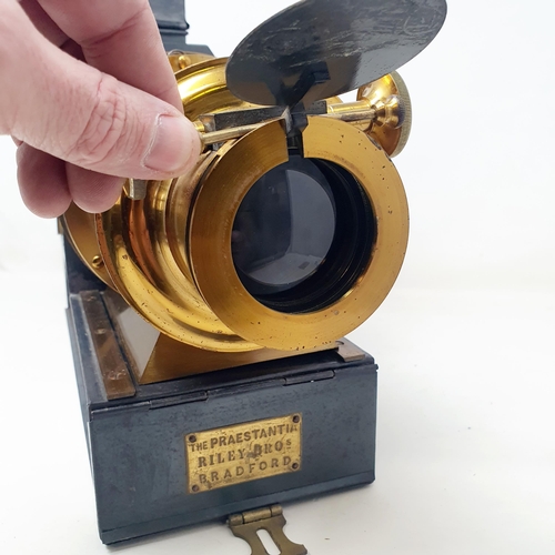 156 - A Praestantia magic lantern, in a metal case, with a parafin burner