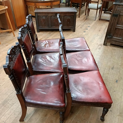 901 - A set of six late 19th century carved walnut dining chairs, with leather padded backs and seats (6)