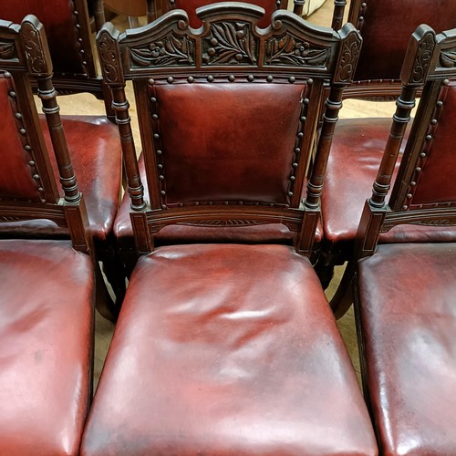 901 - A set of six late 19th century carved walnut dining chairs, with leather padded backs and seats (6)