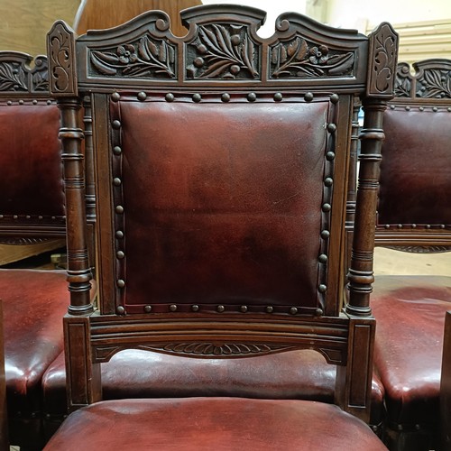 901 - A set of six late 19th century carved walnut dining chairs, with leather padded backs and seats (6)