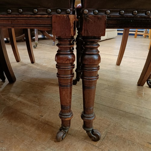 901 - A set of six late 19th century carved walnut dining chairs, with leather padded backs and seats (6)