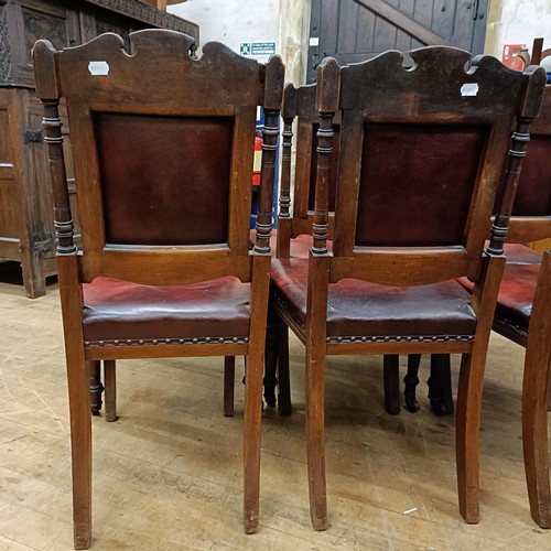 901 - A set of six late 19th century carved walnut dining chairs, with leather padded backs and seats (6)