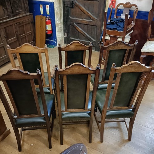 902 - A set of six oak dining chairs, with padded backs and seats (6)