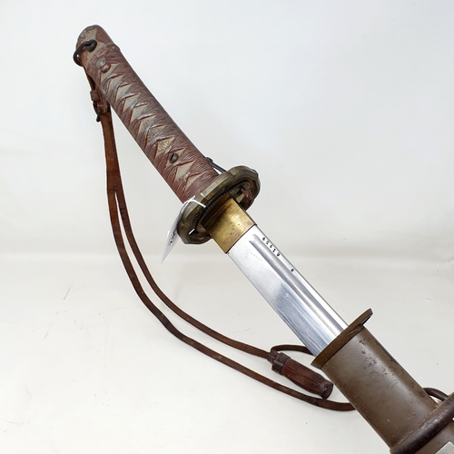 542 - A Japanese WWII era katana, with a faux cord and fish skin (metal) handle, a plain tsuba, the blade ... 