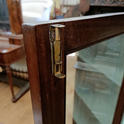 974 - An early 20th century mahogany display cabinet, 92 cm wide