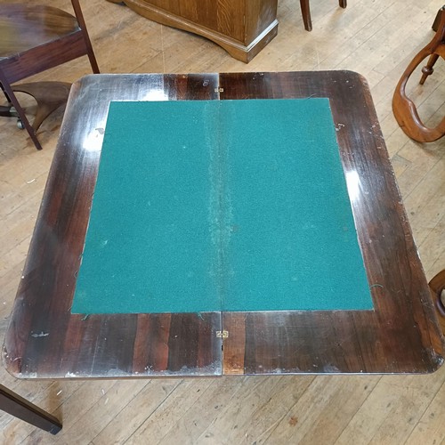 987 - A 19th century rosewood folding card table, 94 cm wide