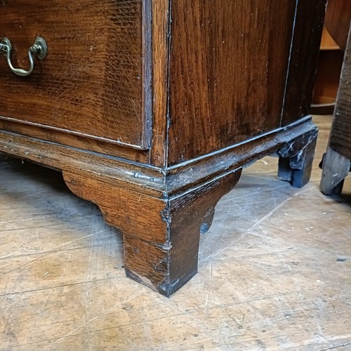 988 - A George III oak bureau, 93 cm wide, an oak cupboard, 95 cm wide, a folding card table and a washsta... 