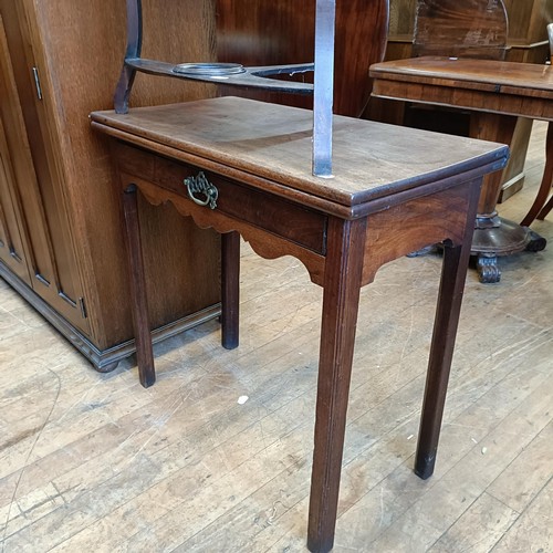 988 - A George III oak bureau, 93 cm wide, an oak cupboard, 95 cm wide, a folding card table and a washsta... 