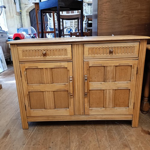 990 - An oak sideboard, 120 cm wide, a teak bookcase, two glazed bookcases, an oak drop leaf table, four c... 