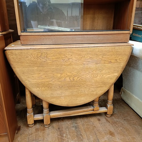 990 - An oak sideboard, 120 cm wide, a teak bookcase, two glazed bookcases, an oak drop leaf table, four c... 