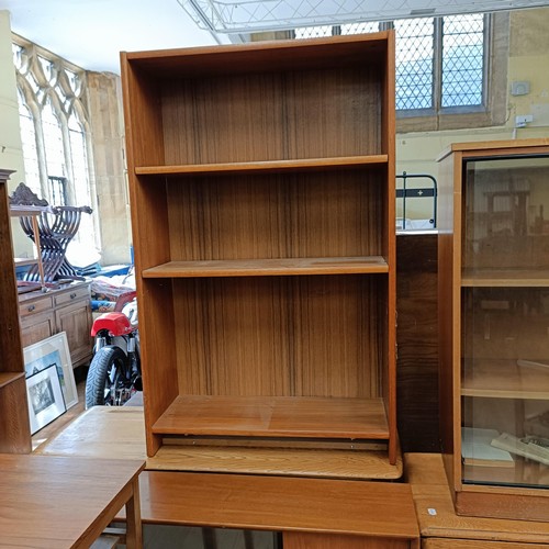 990 - An oak sideboard, 120 cm wide, a teak bookcase, two glazed bookcases, an oak drop leaf table, four c... 