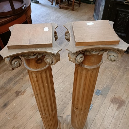 999 - A pair of pine pedestals in the form of Corinthian columns, 114 cm high