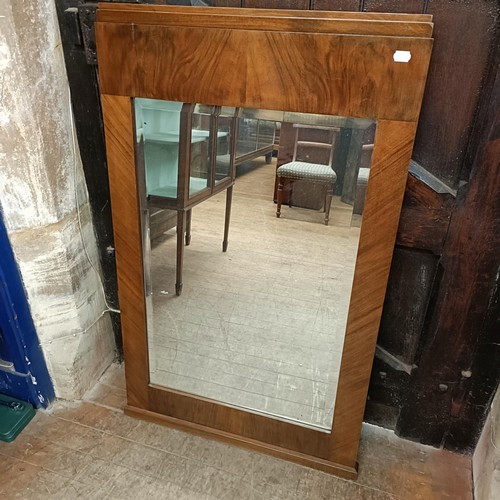 1002 - A 1920s French walnut wall mirror, 124 x 75 cm