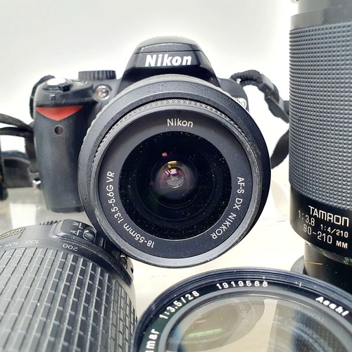165 - A Kodak bellows camera, a Pentax ME Super camera, a Nikon D60 camera, assorted lenses, and related i... 