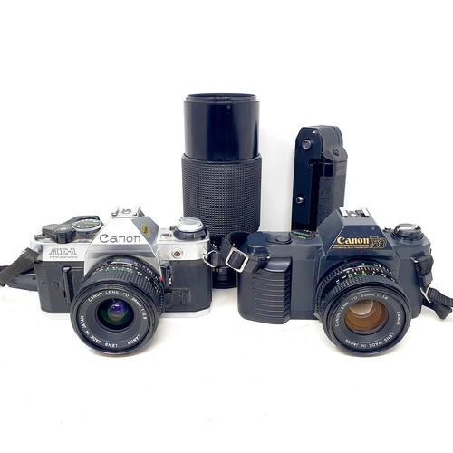 164 - A Canon AE-1 camera, a Canon T50 camera, a lens, another, and other related items