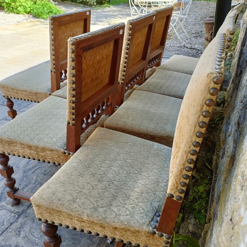 1010 - A set of eight walnut framed dining chairs, with padded back and seat (8)