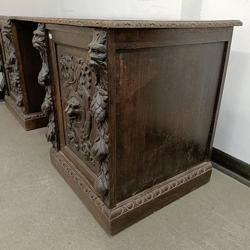 1034 - A carved oak sideboard, 187 cm wide