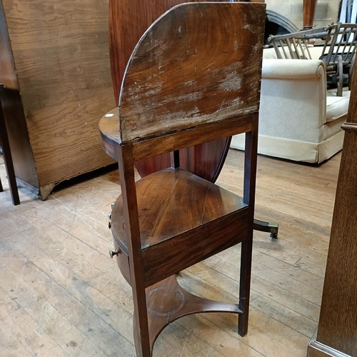 1040 - A tilt top mahogany breakfast table, 120 cm diameter, and a washstand