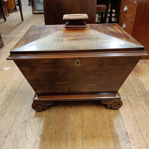 1041 - A 19th century mahogany wine cellarette, on carved scroll feet, 66 cm wide