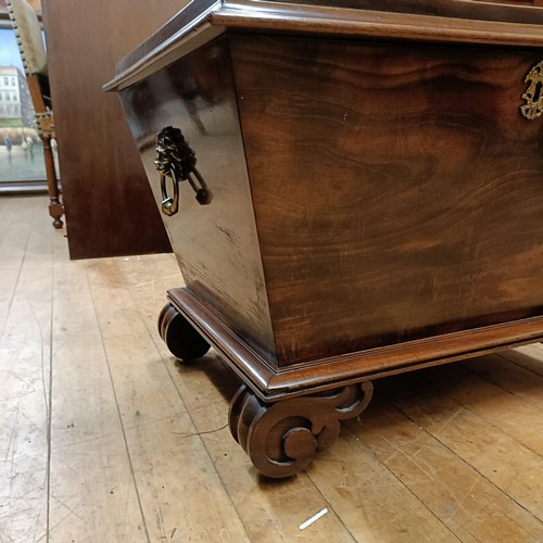 1041 - A 19th century mahogany wine cellarette, on carved scroll feet, 66 cm wide