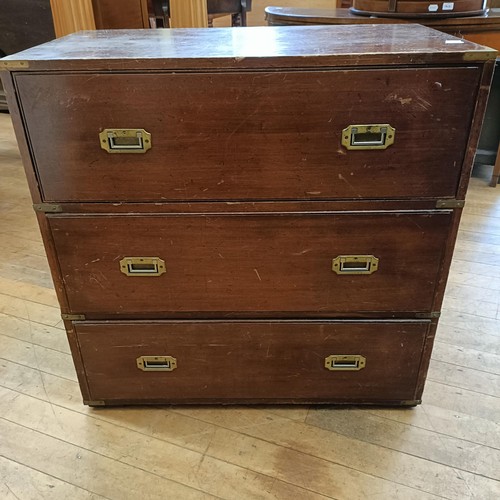 1042 - A mahogany and brass bound campaign style chest, having three drawers, 80 cm wide