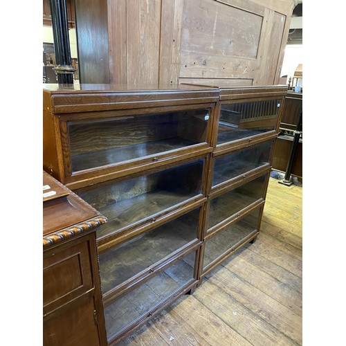 922 - A pair of Globe Wernicke style four section bookcases, 137 cm high x 88 cm wide