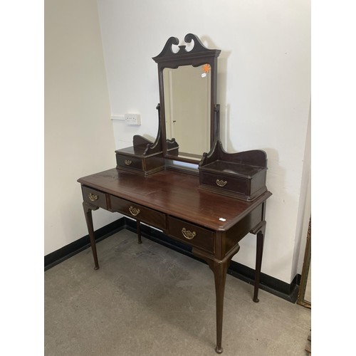 973 - A Gillows mahogany dressing table, the central drawer stamped, 128 cm wide